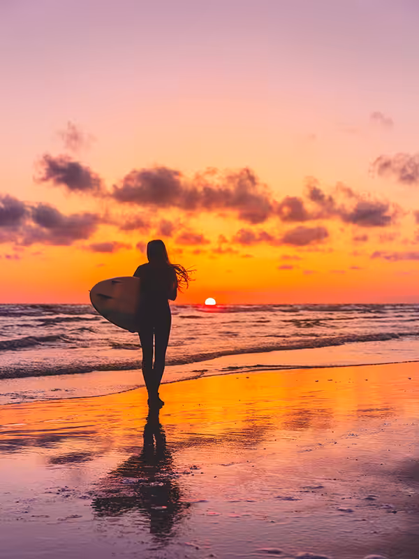 woman on beach surfing 1 1